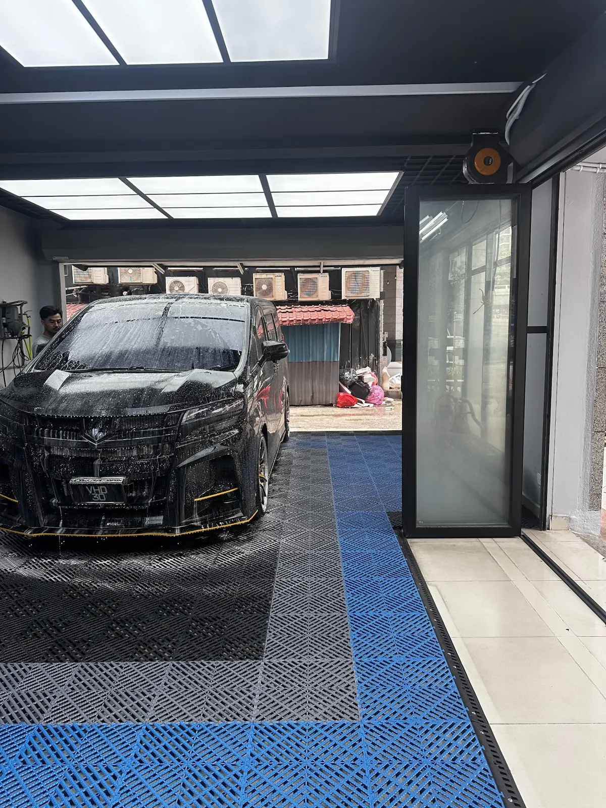 Black Toyota Alphard entering the KOYA bay