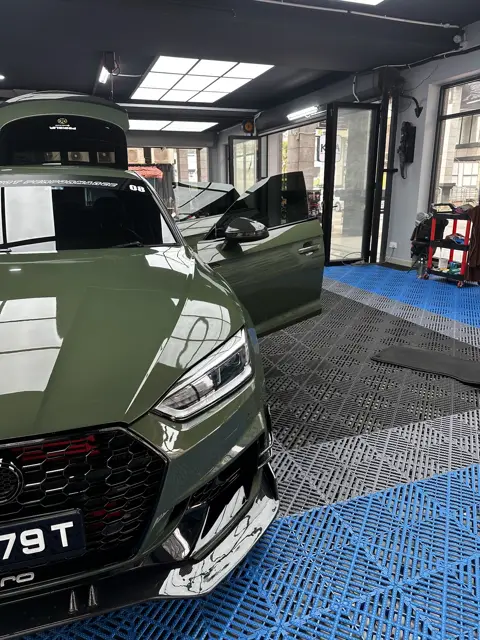 Green Audi RS5 in the KOYA bay