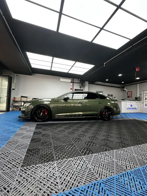 Green Audi RS5 in the KOYA bay