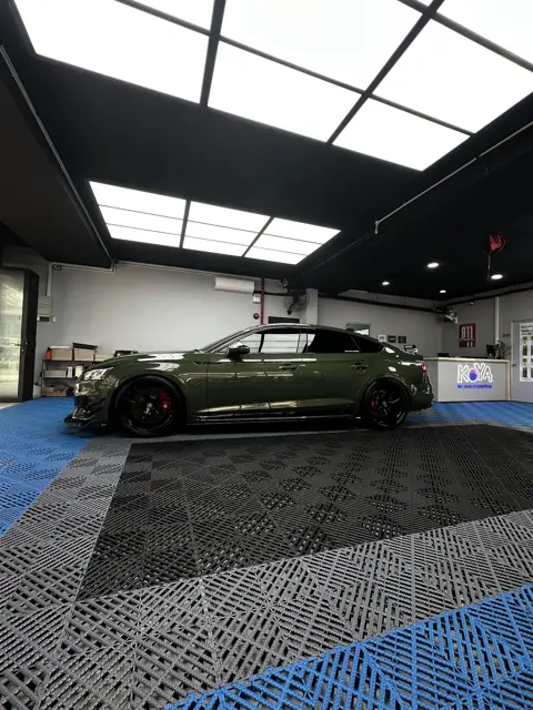 Green Audi RS5 in the KOYA bay