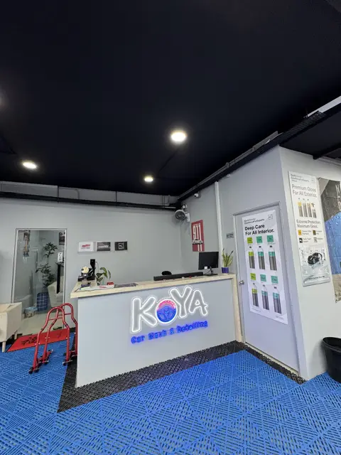 KOYA reception counter with illuminated logo