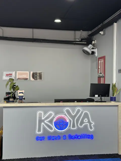 KOYA reception counter with illuminated logo