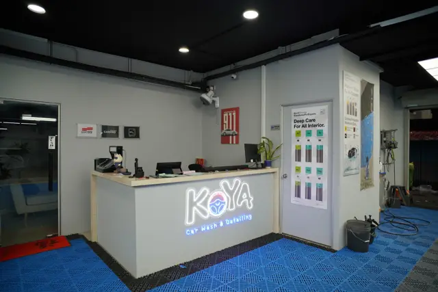 KOYA reception counter with illuminated logo