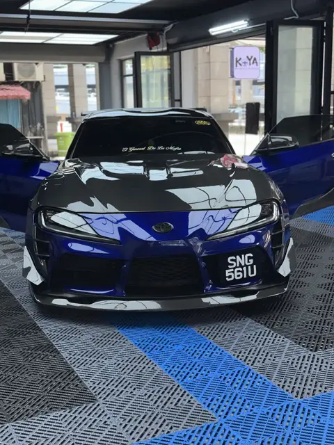 Blue Toyota Supra with carbon bonnet at KOYA