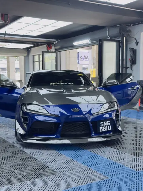 Blue Toyota Supra with carbon bonnet at KOYA
