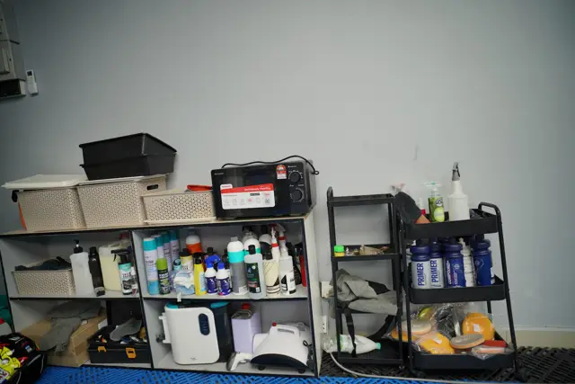 Shelves of detailing products and tools at KOYA