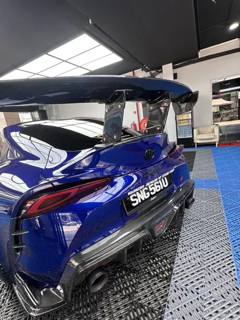 Blue Toyota Supra rear wing and exhaust after detailing